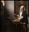 Woman-with-a-balance-by-Vermeer.jpg